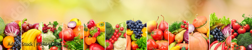 Healthy vegetables and fruits on multicolored blurred background.