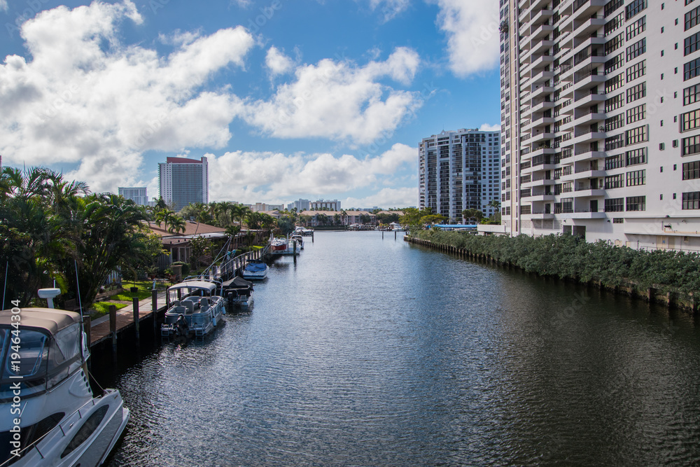 Smooth waterway view with docked boats Smooth waterway view with docked boats