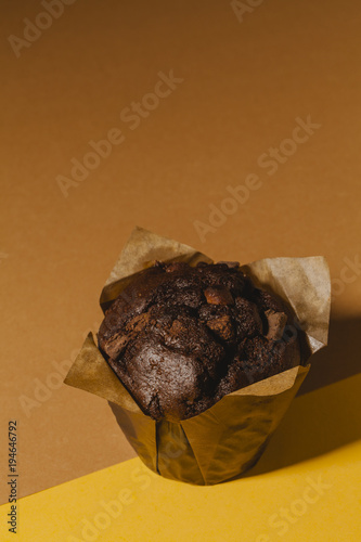 Chocolate brownie with yellow and orange background.