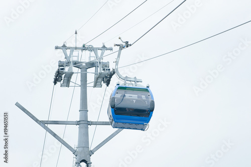 Blue cabin cable car at the tower. Bottom view