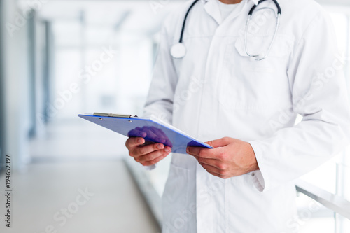 Doctor with paperboard