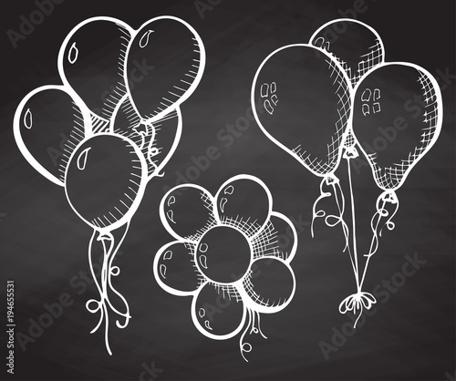 Group of balloons on a string. Hand drawn chalk on the board.