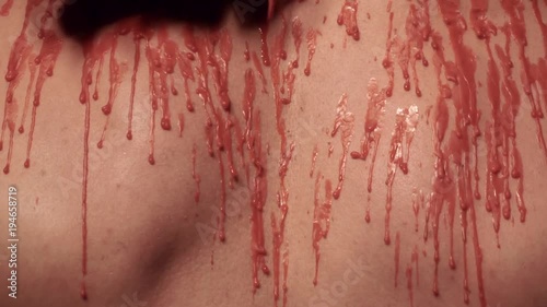 Dripping wax on a male body