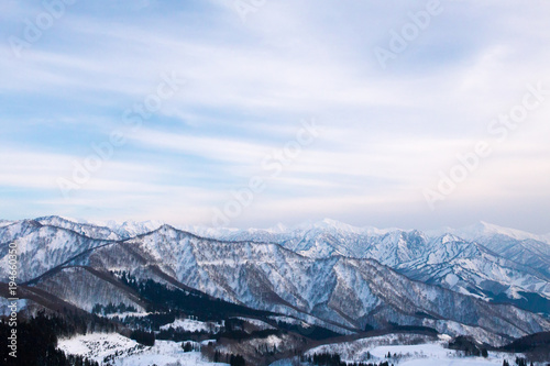snowy mountains in the evening