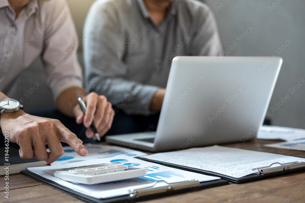 Business team meeting working with new startup project, discussion and analysis data the charts and graphs. Digital tablet calculator, laptop computer using, Business finances and accounting concept Business team meeting working with new startup project, discussion and analysis data the charts and graphs. Digital tablet calculator, laptop computer using, Business finances and accounting concept