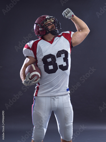american football player celebrating touchdown
