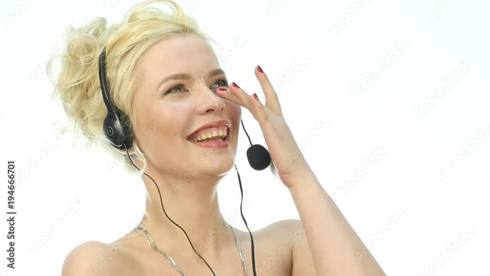 Sexy laughing woman talking on helpline, Headset telemarketing positive female call center agent at work. Sexy laughing woman talking on helpline, Headset telemarketing positive female call center agent at work.