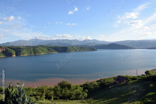 Debar Debarsko Lake in Macedonia, with mountains background. © arkadiwna