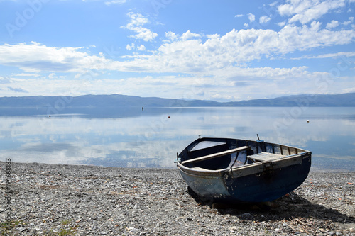 Old boat laying on lake beach. Ohrid Lake, Macedonia.