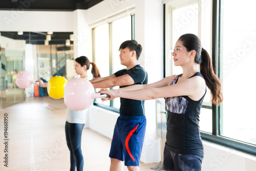 happy fitness learning holding kettlebell © PR Image Factory