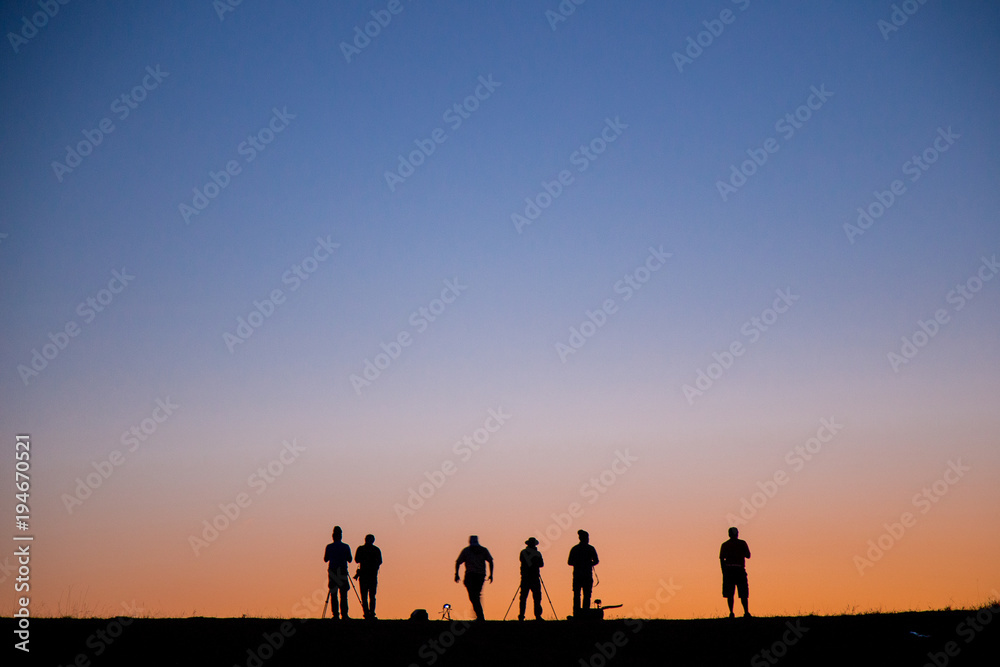 Photographer take photo with sunset sky very romantic view to watch when you go to the top of mountain Photographer take photo with sunset sky very romantic view to watch when you go to the top of mountain