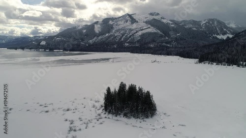 Ice Cold Frozen Lake Drone Shot in Winter Wilderness photo