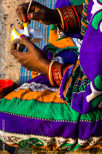 Indian woman painting handicrafts in Raghurajpur artists village, Puri, Orissa, India