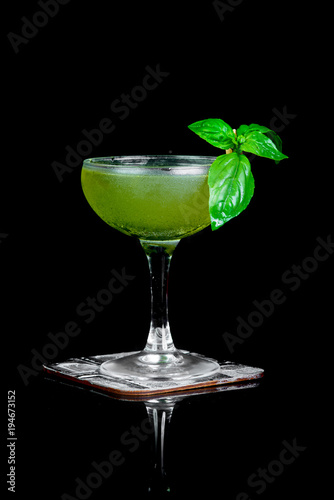 alcoholic drink with fresh mint on a black background