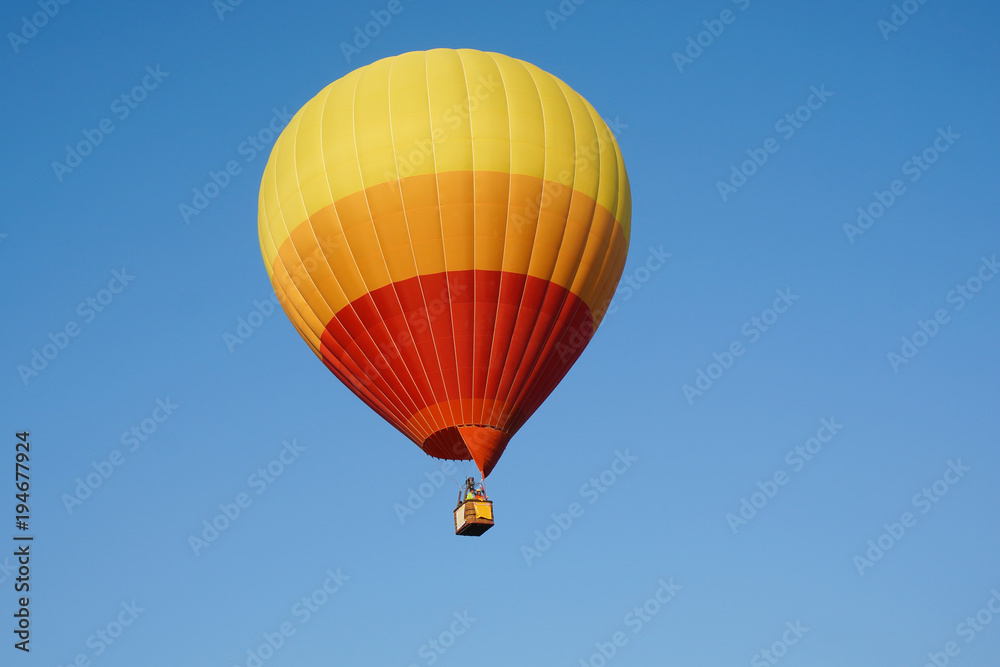 Hot air balloon in blue sky, Colorful hot air balloons against blue sky Hot air balloon in blue sky, Colorful hot air balloons against blue sky