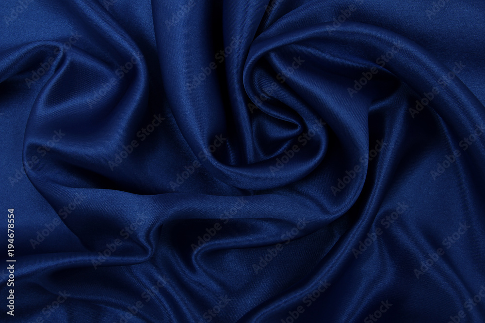 Smooth elegant blue silk or satin luxury cloth texture as abstract background. Luxurious background design Smooth elegant blue silk or satin luxury cloth texture as abstract background. Luxurious background design