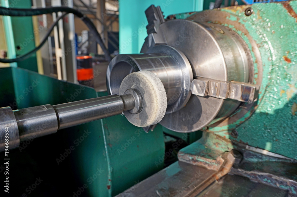 Spindle with an abrasive circle for intra grinding work on the grinder. Dry grinding by a circle end face by a long frame and thin white stone. There grinding inner sleeve hole. Spindle with an abrasive circle for intra grinding work on the grinder. Dry grinding by a circle end face by a long frame and thin white stone. There grinding inner sleeve hole.