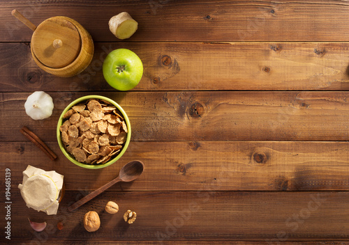 cereal flakes and healthy food on wood