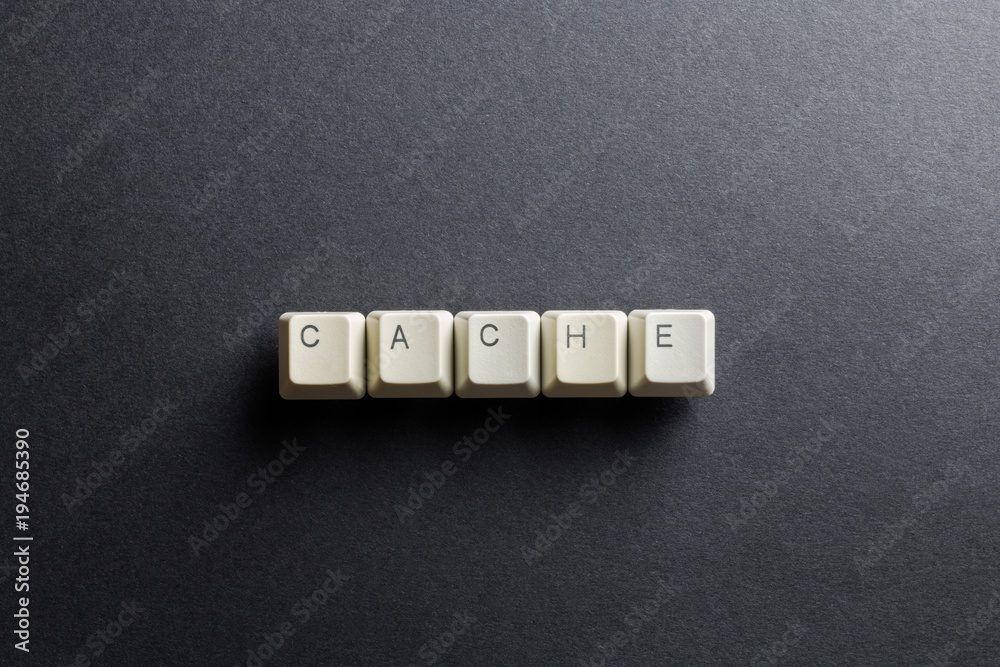 Word cache made using computer keyboard buttons on a black background. Compact disk. IT technology concept. Word cache made using computer keyboard buttons on a black background. Compact disk. IT technology concept.
