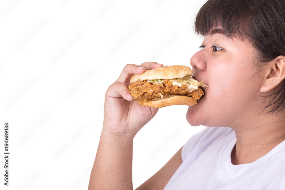 Fat asian woman eating fried chicken hamburger isolated on white. food and healthcare concept