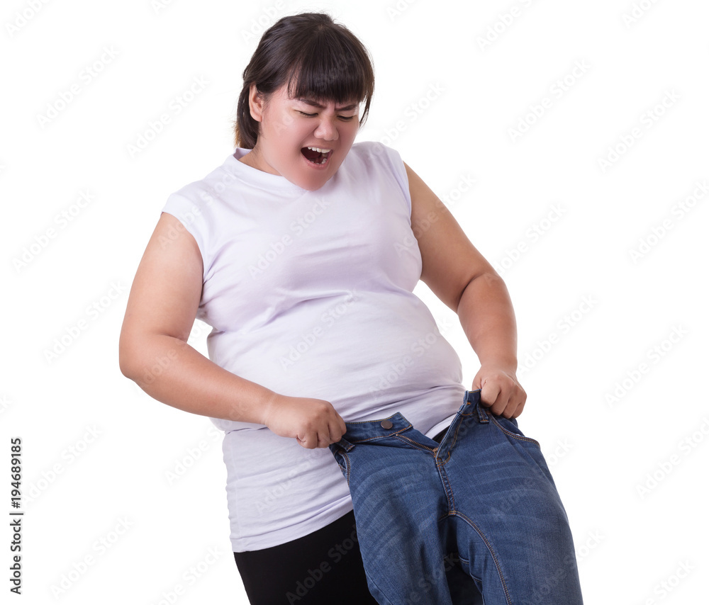 Fat asian woman trying to wear small size jeans isolated on white. Fat and  Healthcare concept Stock Photo | Adobe Stock