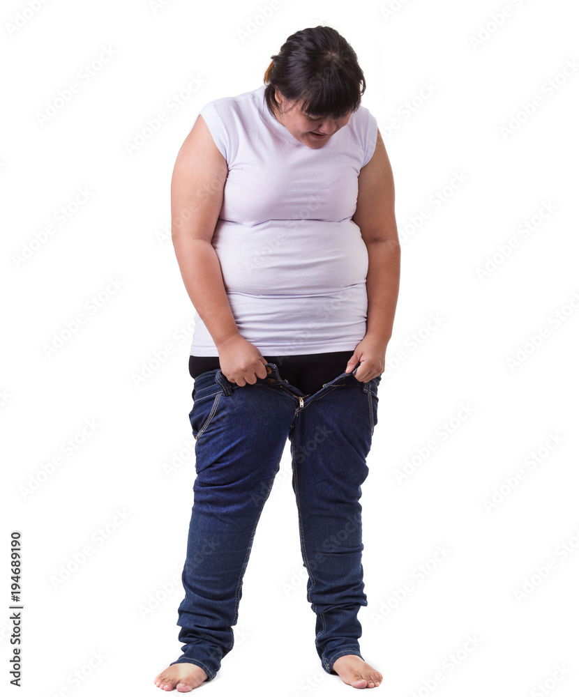 Fat asian woman trying to wear small size jeans isolated on white. Fat and  Healthcare concept Stock Photo | Adobe Stock