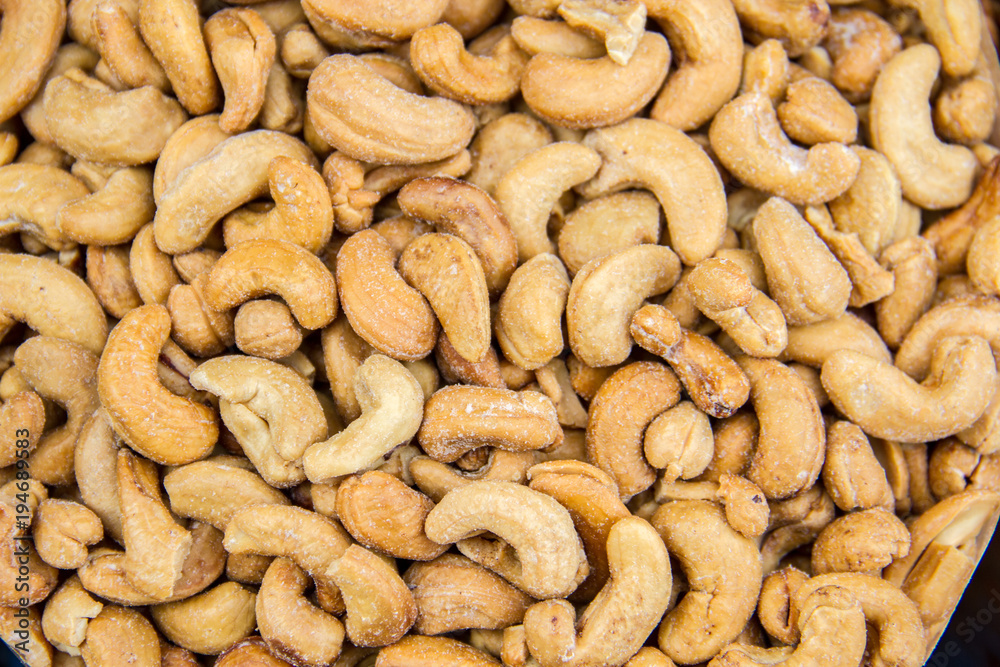 Close up to a bunch of cashews Close up to a bunch of cashews
