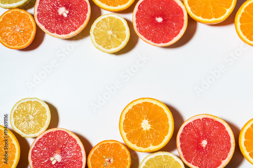 Assorted sliced fruits on white background.  Flat lay. Food vegan concept.