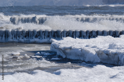 WINTER - Ice on the sea shore and on the palisade