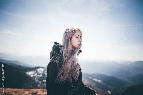 Blonde Woman enjoying mountains landscape Travel Lifestyle wanderlust concept adventure summer vacations outdoor girl traveler in harmony with nature