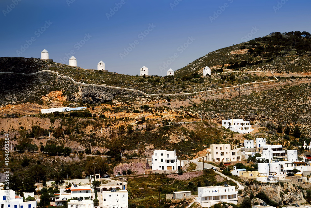 Landscape of Leros island with old traditional windmills in the background, Leros, Dodecanese islands, Greece.