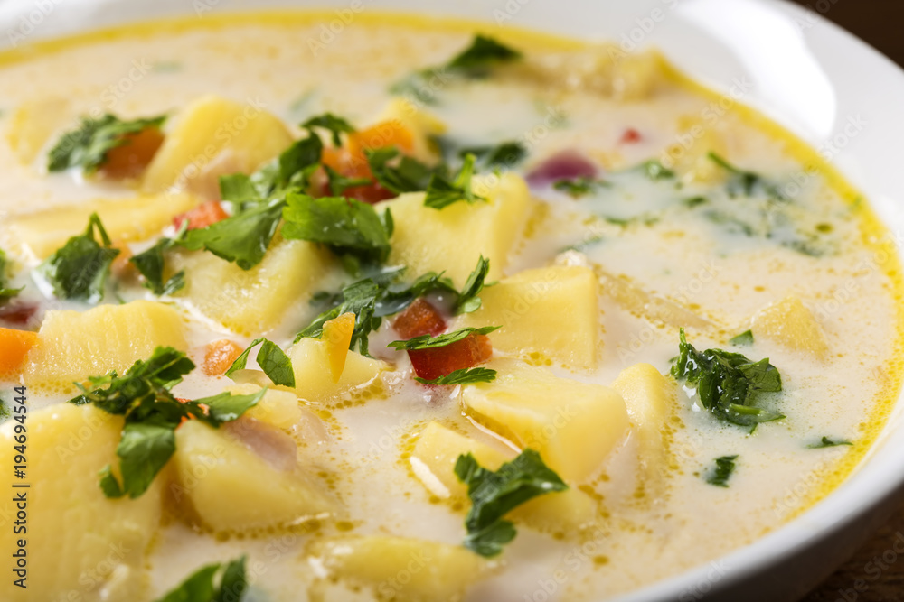 Romanian Homemade potato soup with sour cream and vegetables Romanian Homemade potato soup with sour cream and vegetables