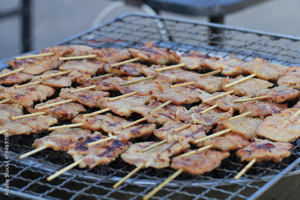 Close up grilled porks on fire stove