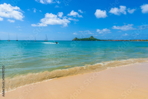 Fototapeta Naklejka Na Ścianę i Meble -  Reduit Beach - Tropical coast on the Caribbean island of St. Lucia. It is a paradise destination with a white sand beach and turquoiuse sea.