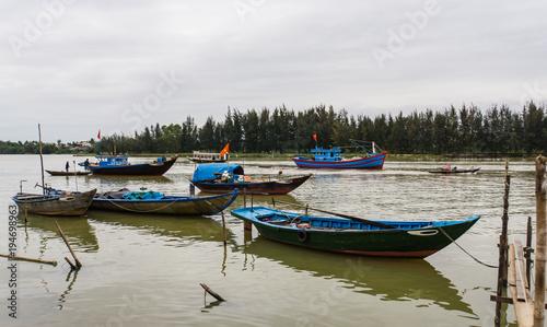  9 fishing boats in all different sizes and for different uses on river 