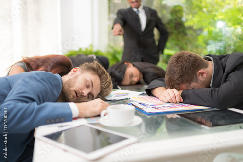 In selective focus of Business people sleeping in the conference room during a meeting.