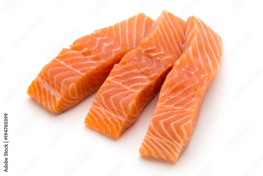 Fresh salmon fillet with basil on the white background. Fresh salmon fillet with basil on the white background.