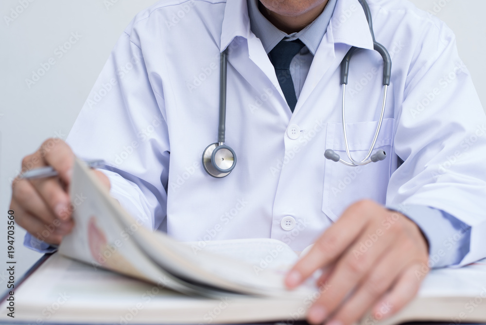 Doctor reading textbook Doctor reading textbook