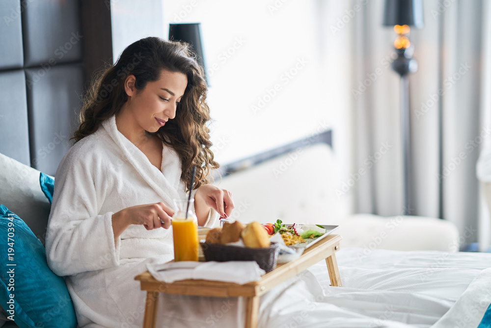 Breakfast in bed, cozy hotel room Breakfast in bed, cozy hotel room