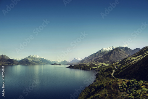Picture of a the Lake Wakatipu and some mountains over a blue sky near Glenorchy, in New Zealand. 