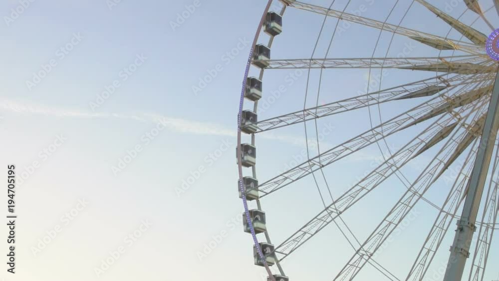 Ferris wheel turning around park, symbol of festive season, cityscape watching Ferris wheel turning around park, symbol of festive season, cityscape watching