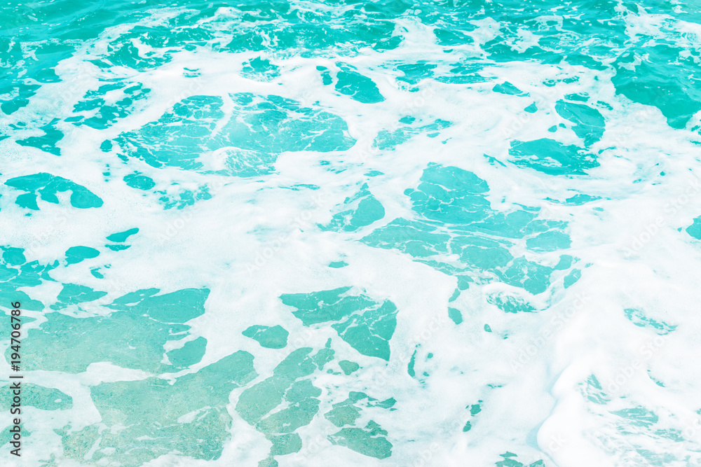 Abstract blue sea water background with white foam. Nature concept.