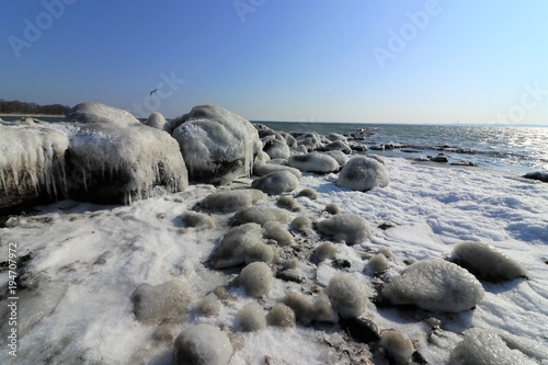 frozen stones by the Baltic Sea coast