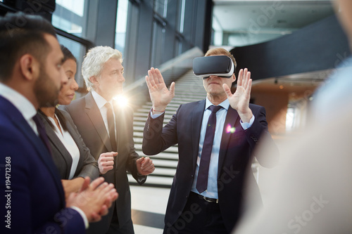 One of modern politicians in vr headset commenting what he sees on virtual display at conference