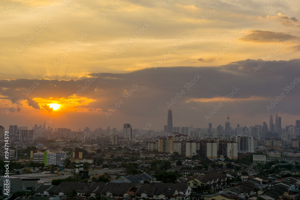 View of sunset at downtown Kuala Lumpur. Its modern skyline is dominated by the 451m tall Petronas Twin Towers, pair of of glass-and-steel-clad skyscraper.