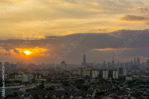 View of sunset at downtown Kuala Lumpur. Its modern skyline is dominated by the 451m tall Petronas Twin Towers, pair of of glass-and-steel-clad skyscraper.