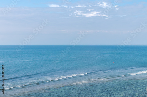 Beautiful sea with blue sky on sunny day. Ocean landscape. Bali island.