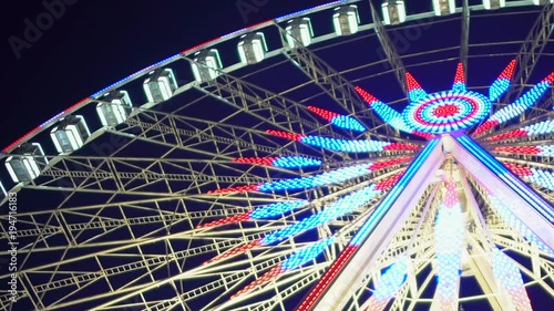 Big Wheel decorated and illuminated with Christmas lights, amusement park symbol photo