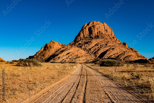 The Spitzkoppe, is a group of bald granite peaks or inselbergs located between Usakos and Swakopmund in the Namib desert of Namibia. photo