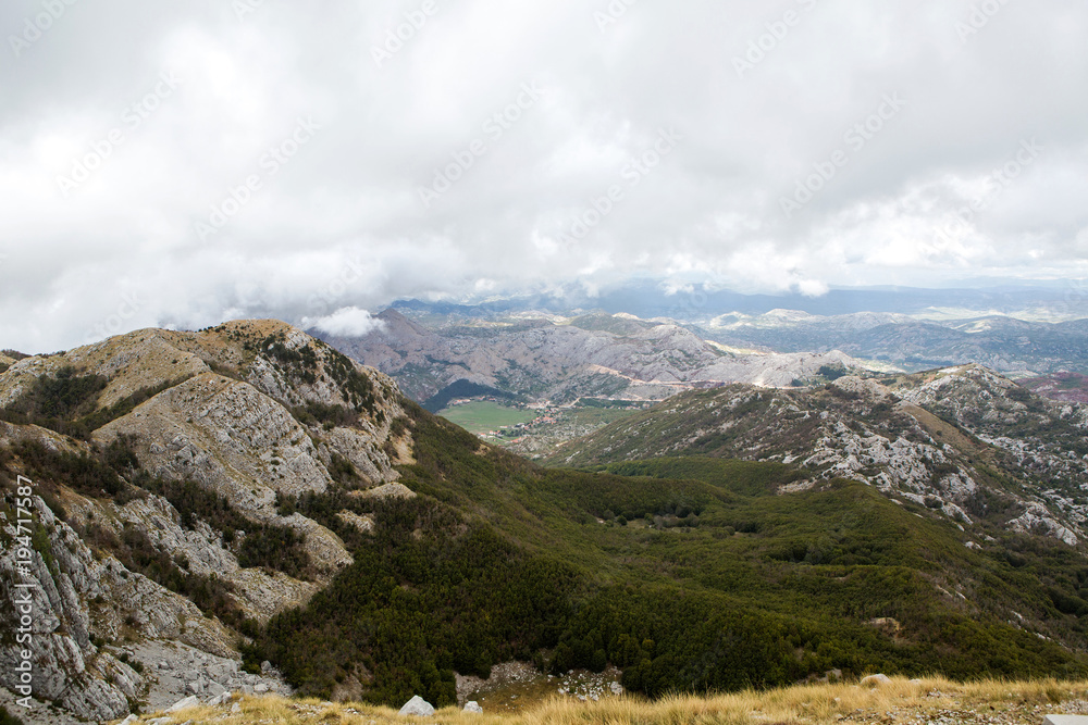 mountain view with thick clouds down to the lowland in Montenegro mountain view with thick clouds down to the lowland in Montenegro